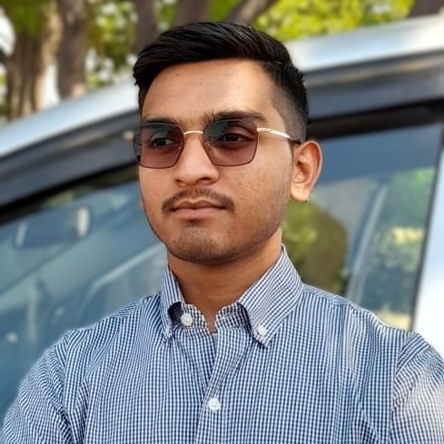 A professional headshot of Tushar